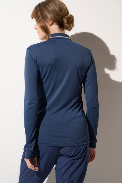 Polo anti-UV bleu pour femme, léger et respirant, UPF 50+, idéal pour le golf ou le tennis en plein soleil.