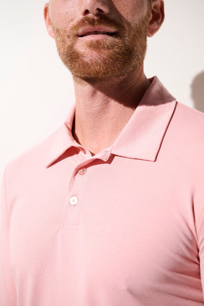 Polo anti-UV rose pour homme, léger et élégant, offrant une protection solaire UPF 50+.