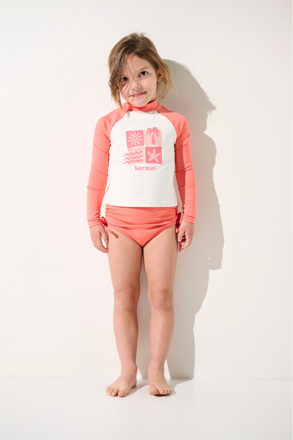 T-shirt de bain anti-UV - Pacific pour enfant, manches longues, léger, UPF 50+, rose, idéal pour les activités aquatiques.