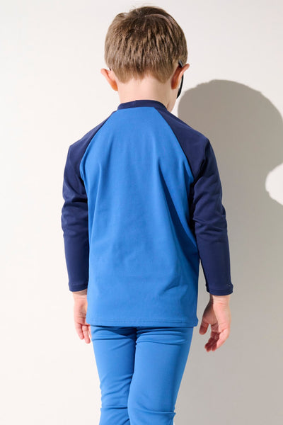 T-shirt de bain anti-UV - Fidji, bleu pour enfant, manches longues UPF 50+, idéal pour la protection solaire à la plage.