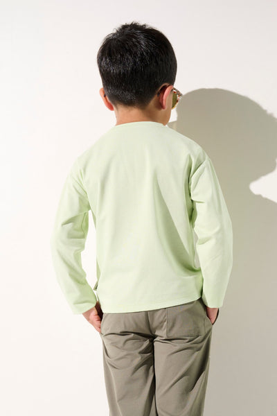 T-shirt anti-UV Saint-Malo vert clair pour garçon, léger et à manches longues, offrant une protection solaire UPF 50+.